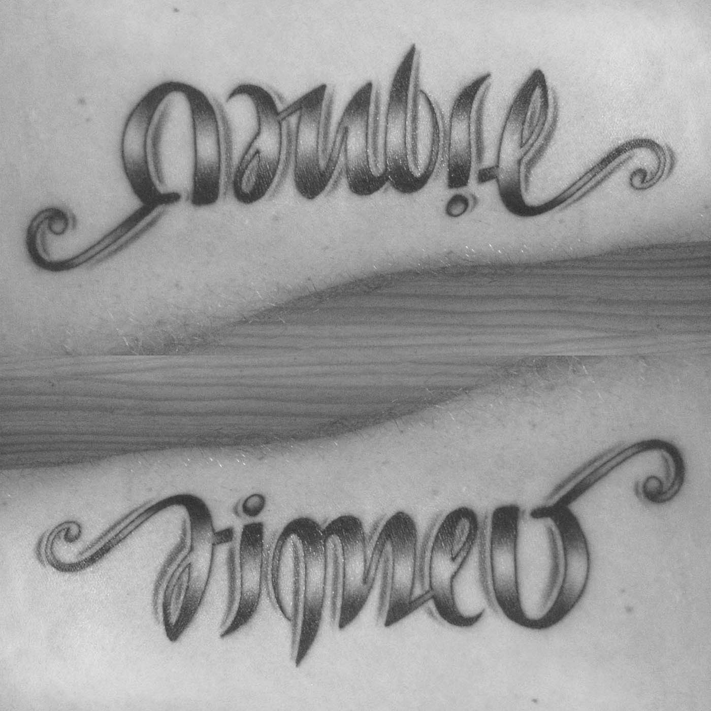 ambigramme Ambre Timeo tattoo