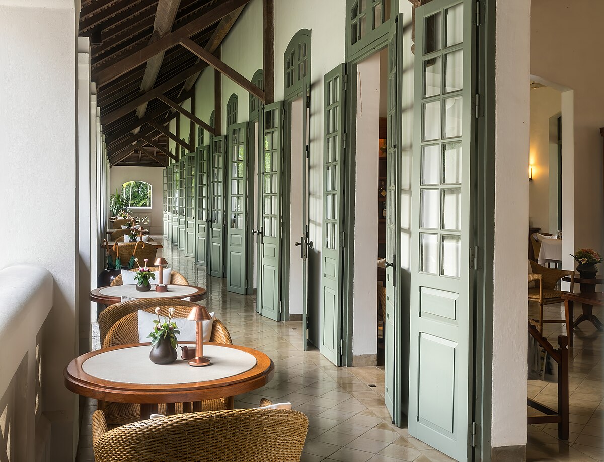 Row of round tables and doors in restaurant of Amantaka