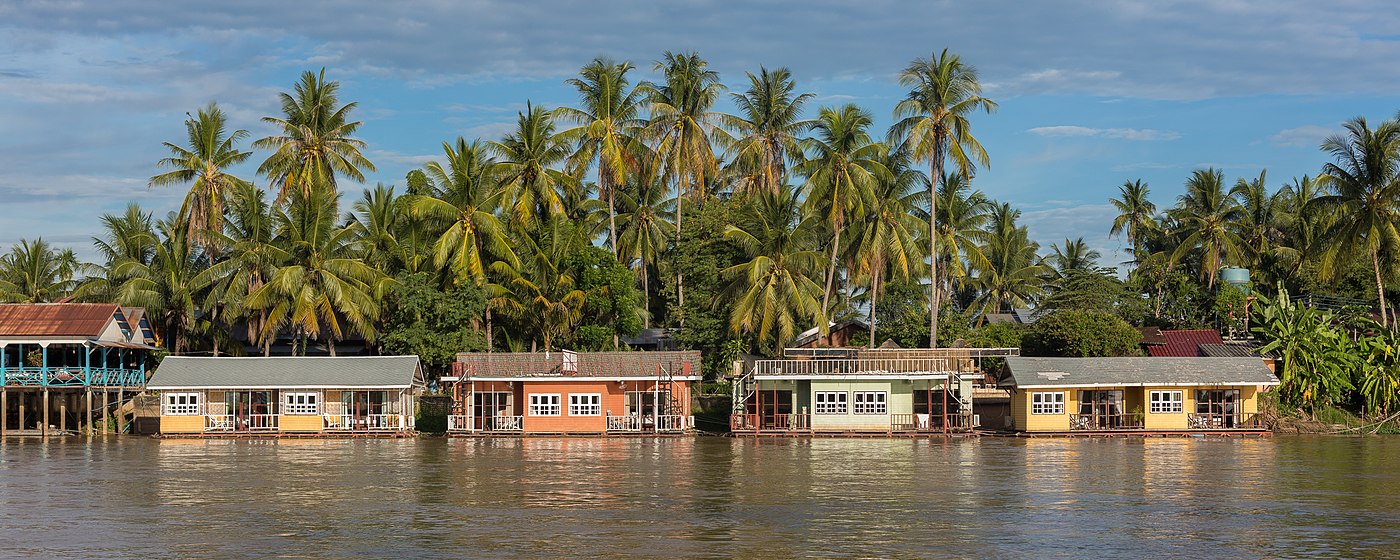 Colorful floating bungalows of Sala Don Khone Hotel, Mekong bank