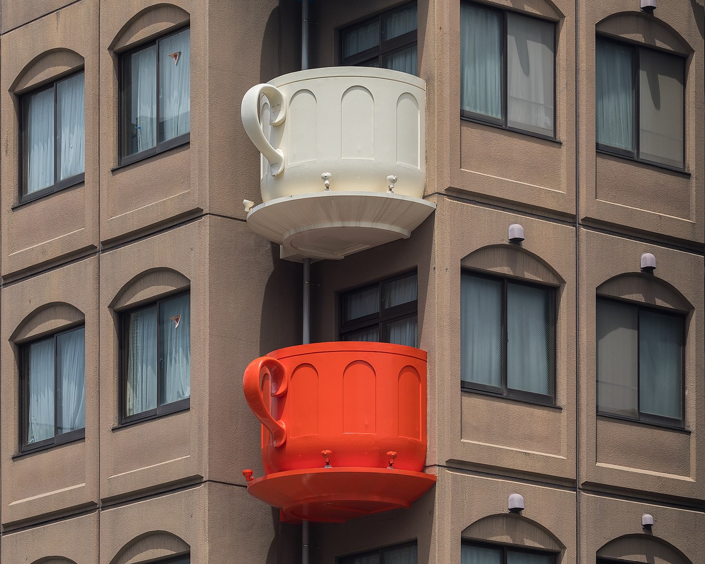 Cream and red coffee cup-shaped balconies Kappabashi, Tokyo