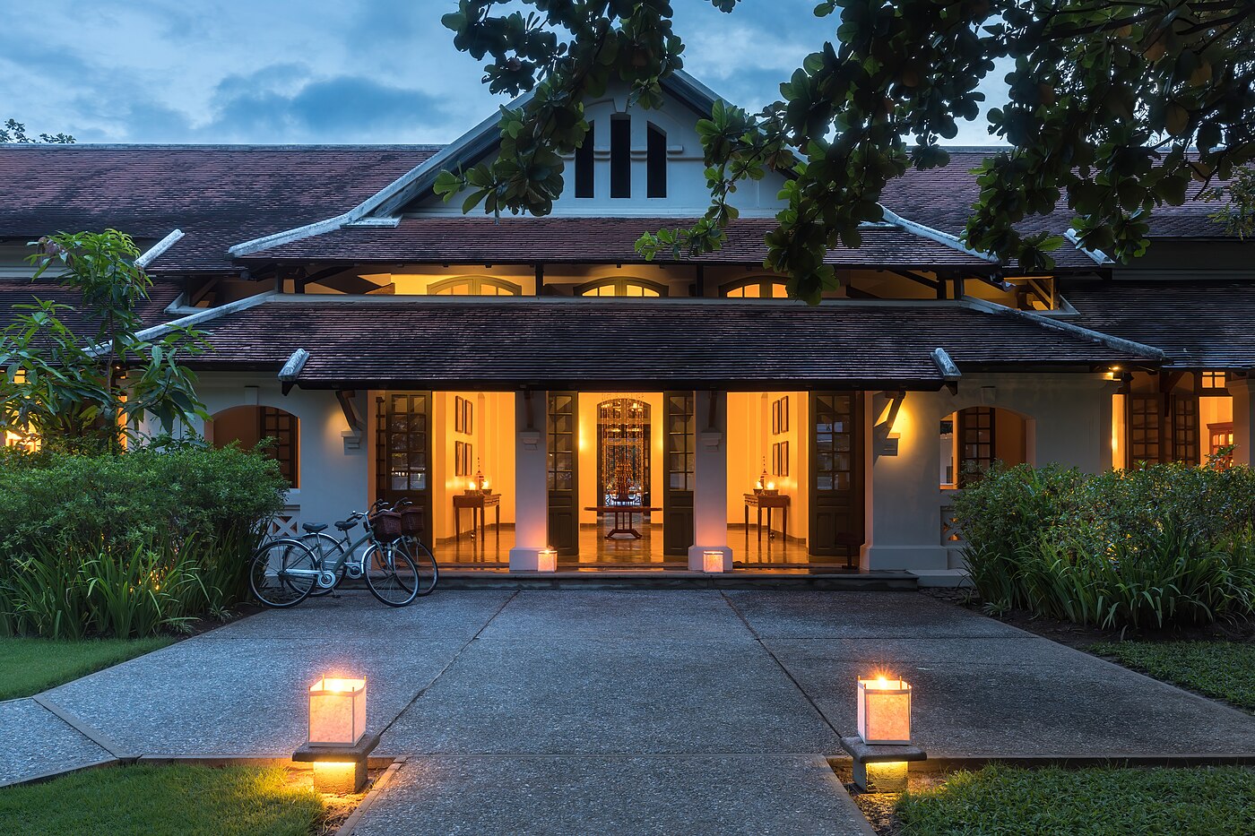 Entrance of Amantaka luxury Resort & Hotel at blue hour in Luang Prabang Laos