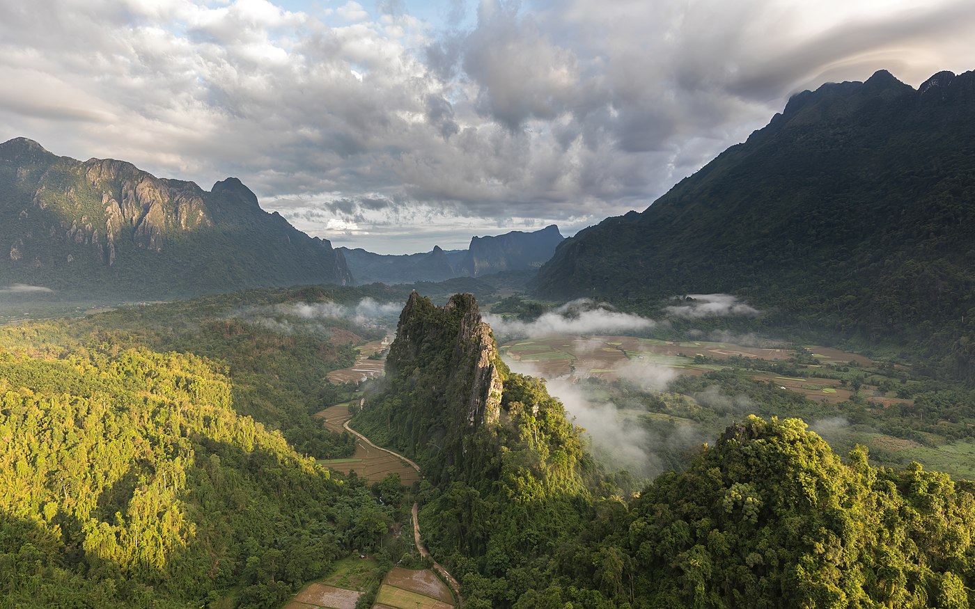 Green karst peaks seen from the top of Mount Nam Xay