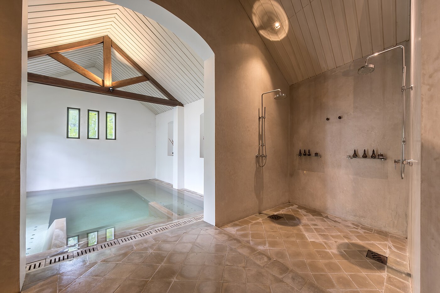 Indoor pool and showers of the spa at Amantaka luxury Resort & Hotel in Luang Prabang Laos