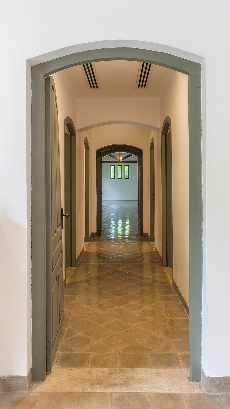 Corridor leading to indoor pool of spa at Amantaka luxury Resort & Hotel in Luang Prabang Laos front view